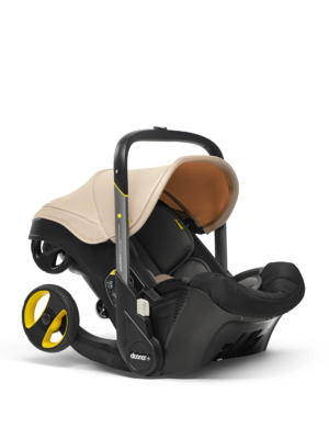 A studio product shot of a Doona brand infant carseat and stroller combo, on a clear background.