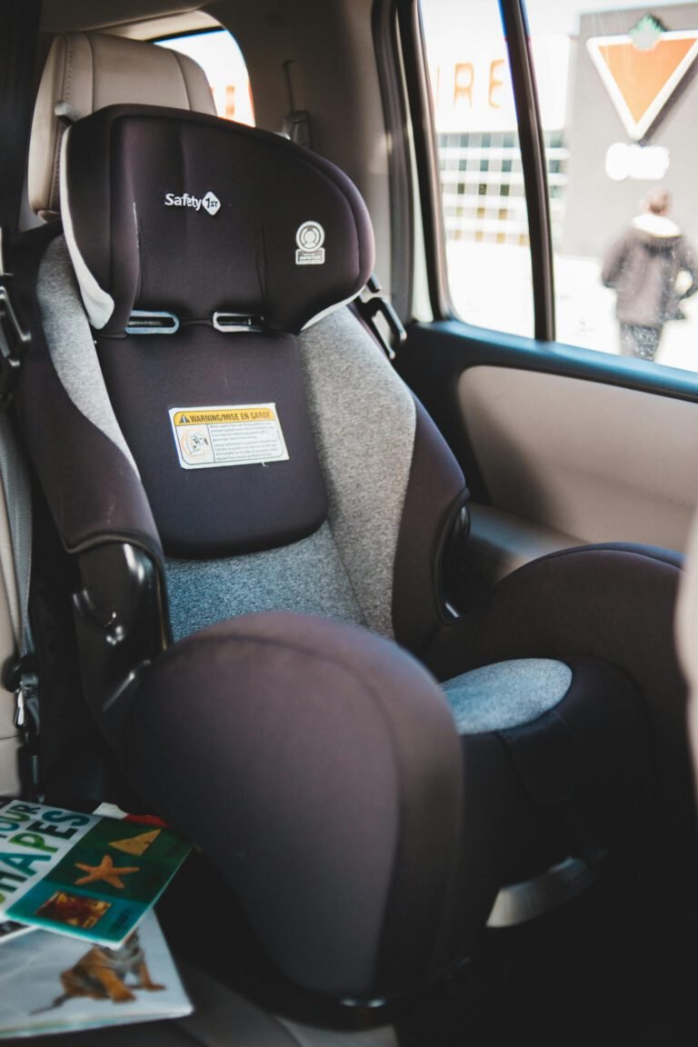 An interior shot of a baby car seat in the back seat of a vehicle.