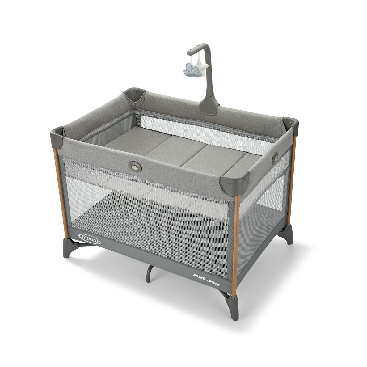 Product shot of gray Graco brand pack and play on white background.